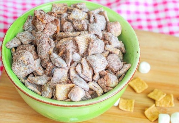 s'mores puppy chow in a green bowl