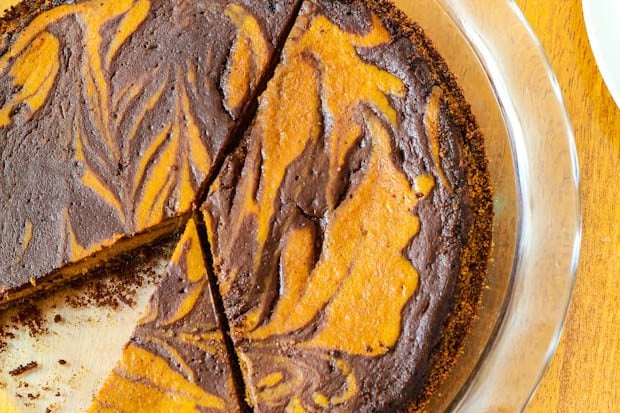 overhead image of Nutella swirled pumpkin pie in a glass pie dish
