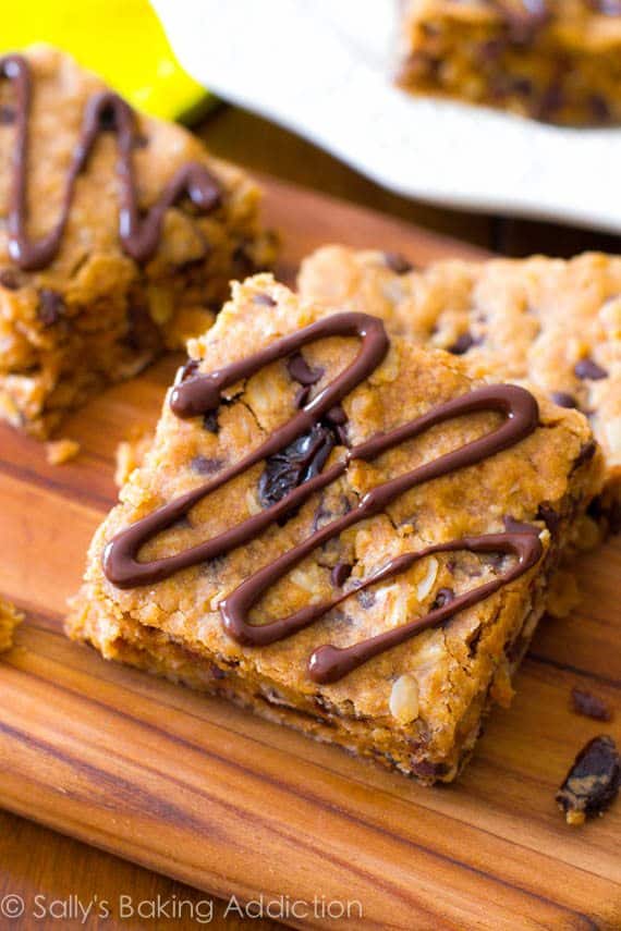 peanut butter chunk oatmeal bars on a wood board