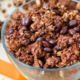triple chocolate crunch granola in a glass bowl