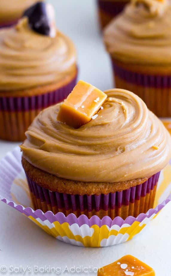 caramel cupcakes topped with salted caramel frosting and caramel candies