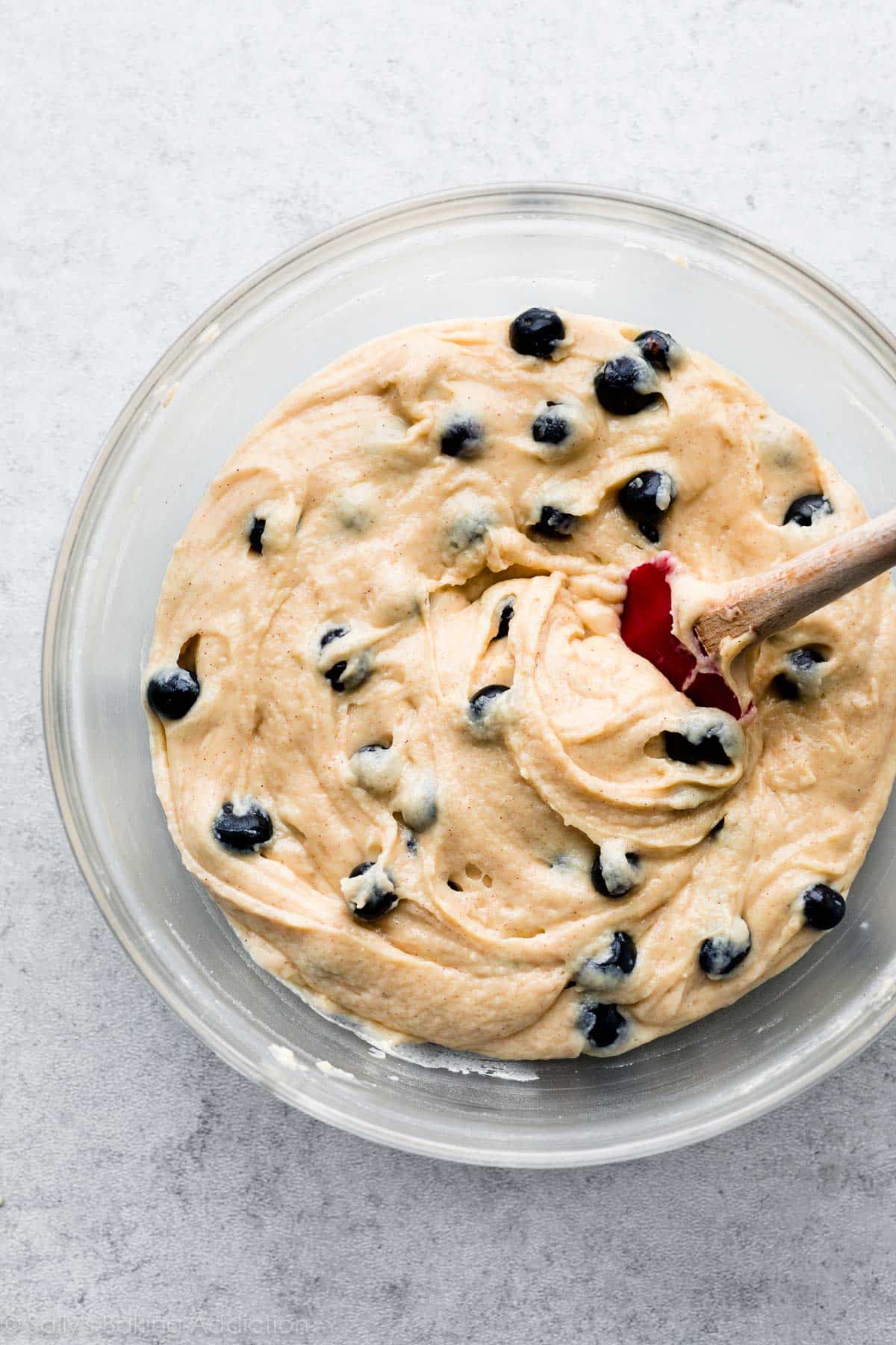 blueberry muffin batter in a glass bowl