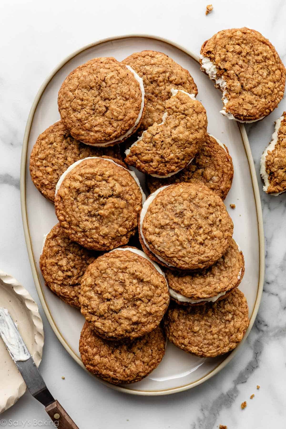 homemade oatmeal cream pies cookies on oval plate.