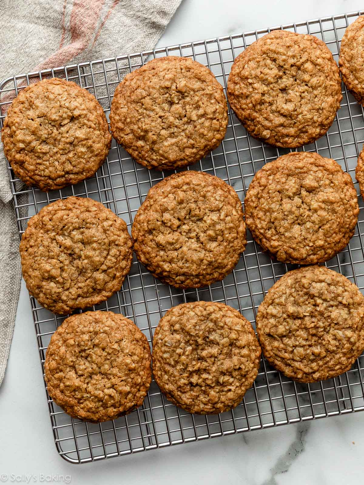 oatmeal cookies on silver cooling rack.