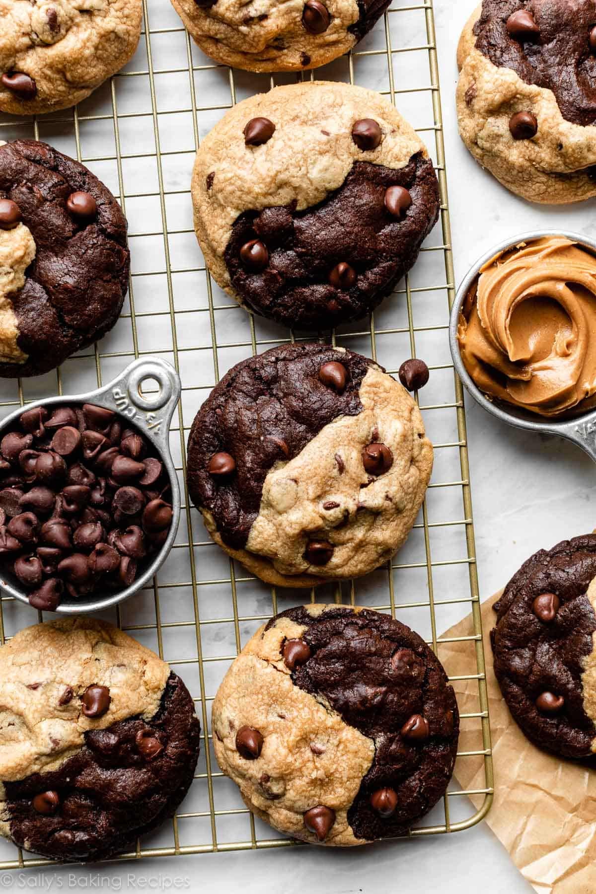 gold cooling rack with peanut butter chocolate swirl cookies on top.