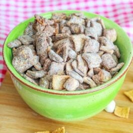 s'mores puppy chow in a green bowl