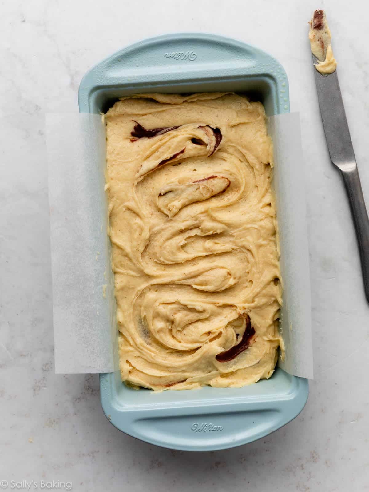 batter in blue loaf pan.