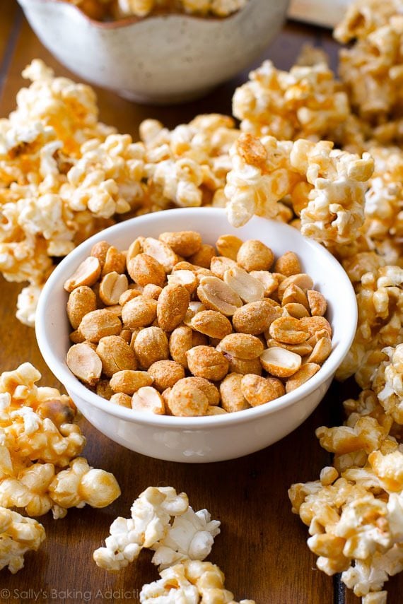 peanut butter caramel corn with a bowl of peanuts