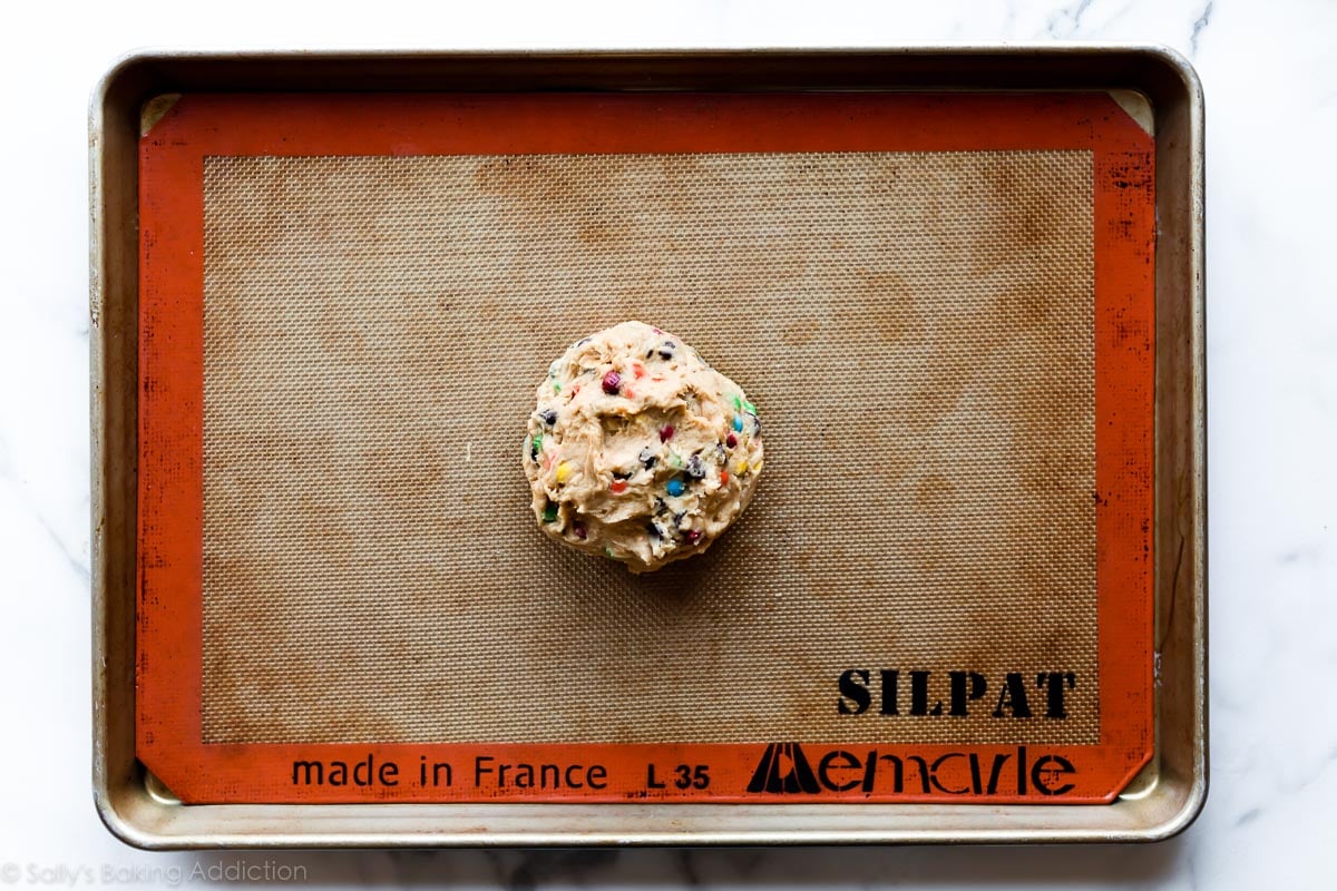 Peanut butter monster cookie dough on baking sheet before baking