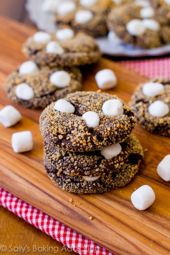 stack of s'mores chocolate crinkle cookies on a wood board