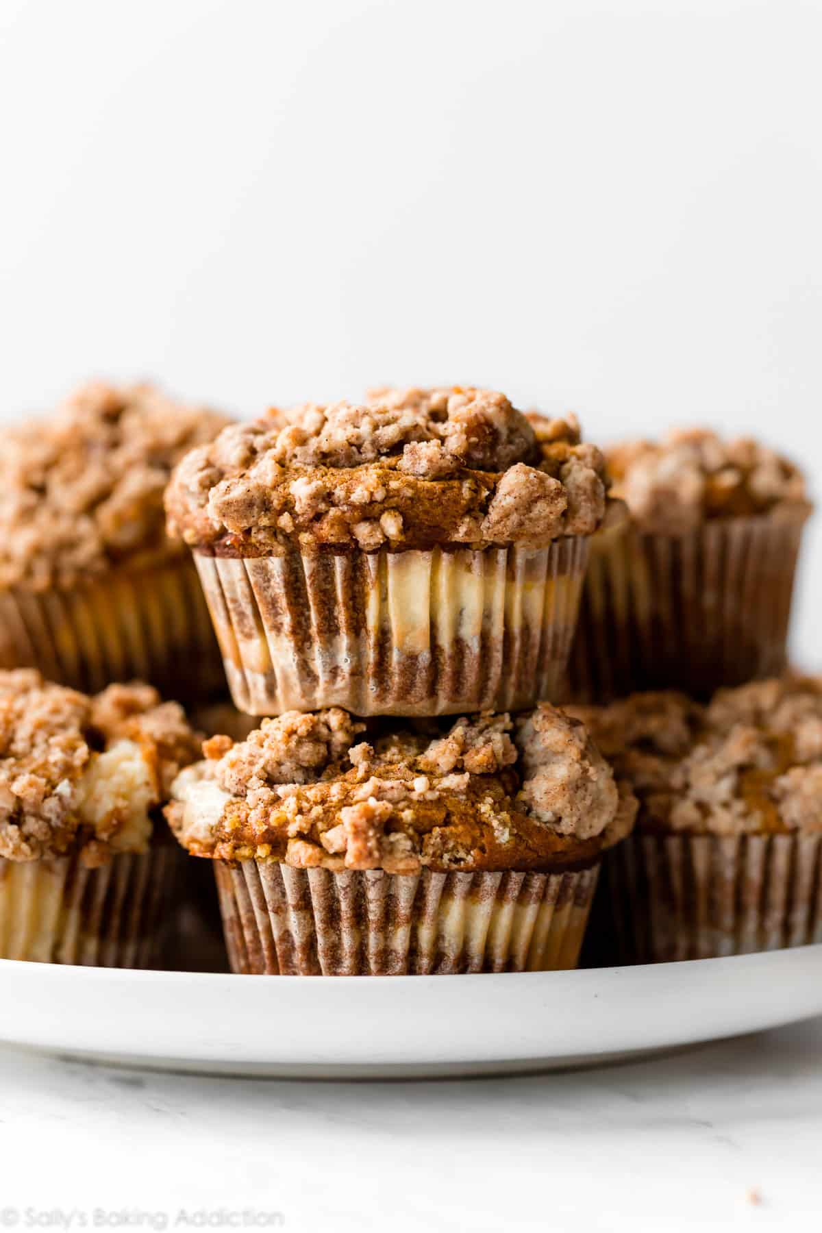 pumpkin cheesecake muffins on a plate