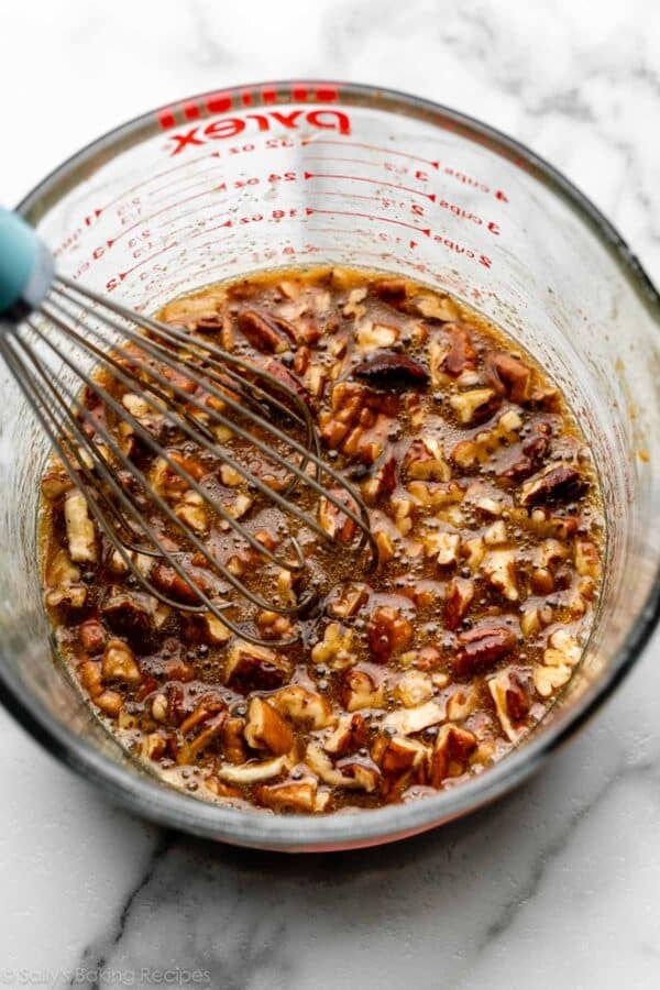 pecan mixture in liquid measuring cup.