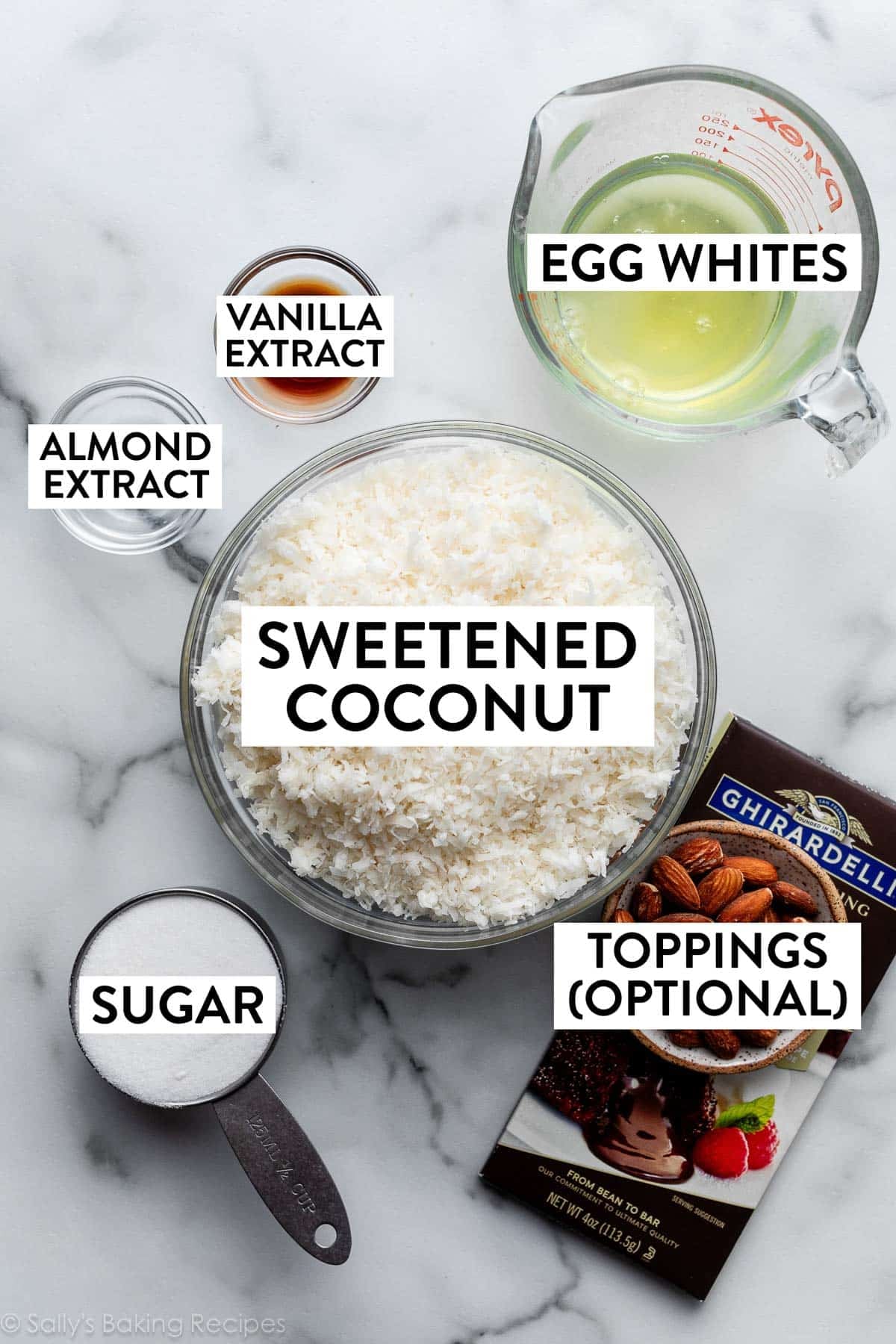 bowls in ingredients including egg whites, chocolate bar, sugar, vanilla extract, and almond extract.