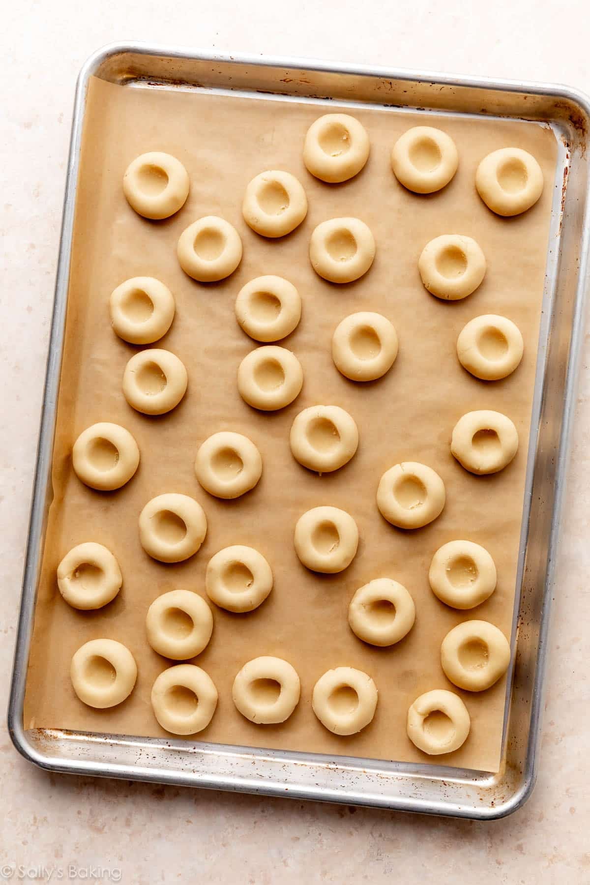 cookie dough shaped into thumbprints without a filling.