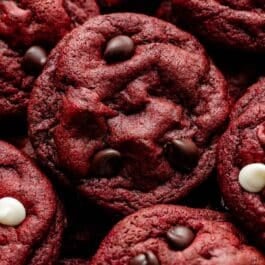 close-up of red velvet chocolate chip and white chocolate chip cookies.