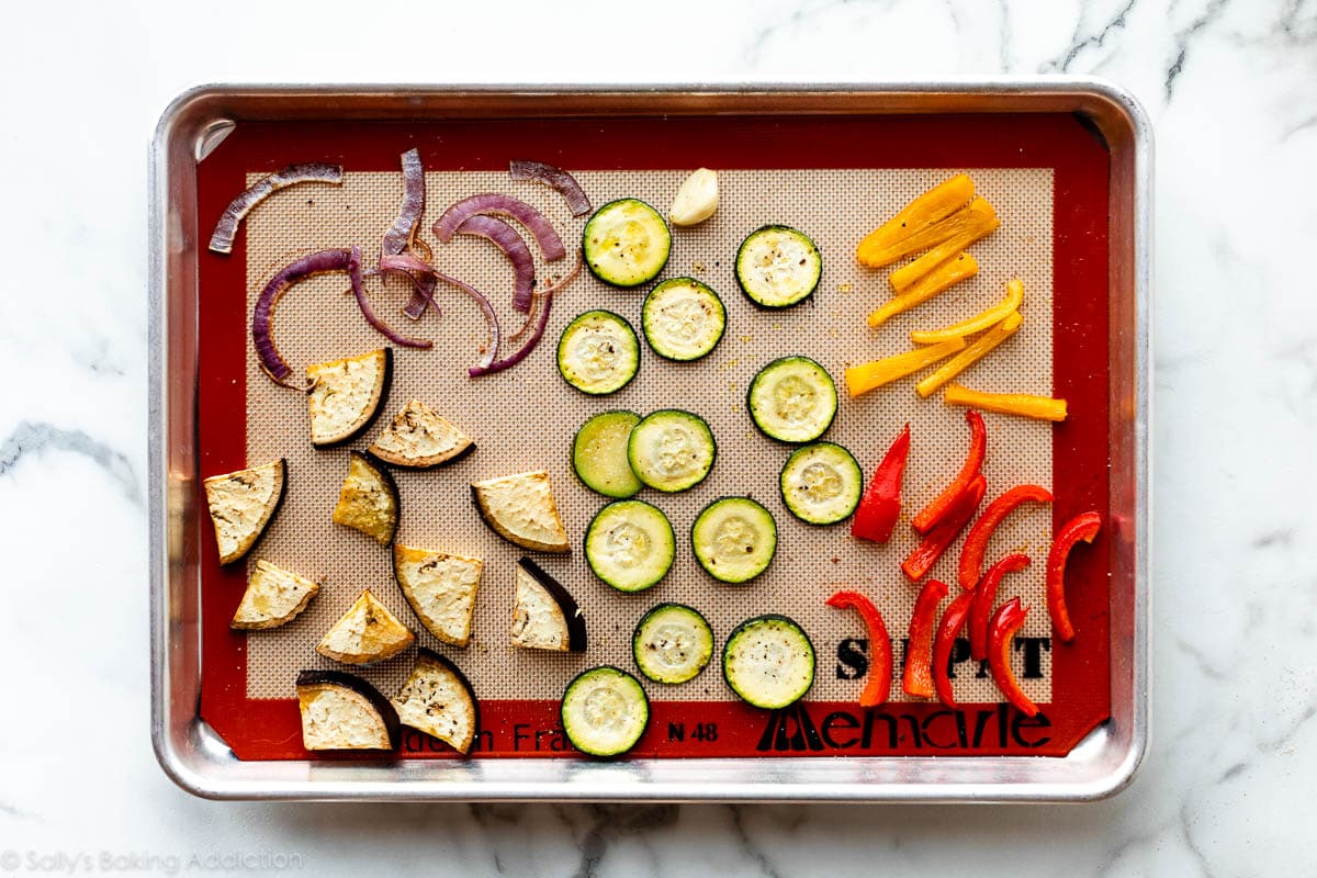 assorted roasted vegetables on lined baking sheet