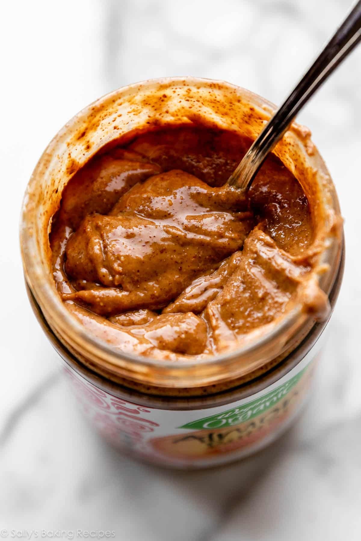 almond butter jar with spoon inside.