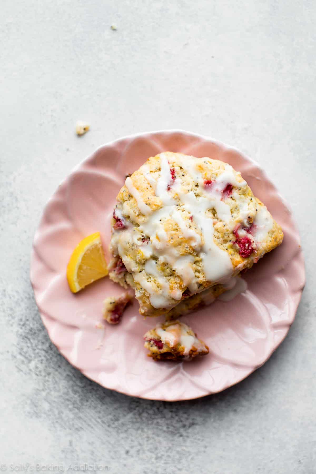 Strawberry lemon poppy seed scones on pink plate