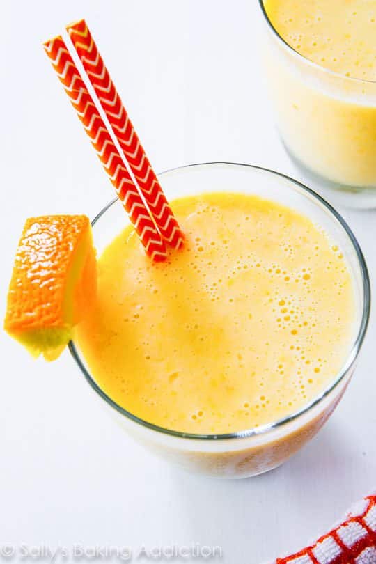 creamsicle smoothie in a glass with straws