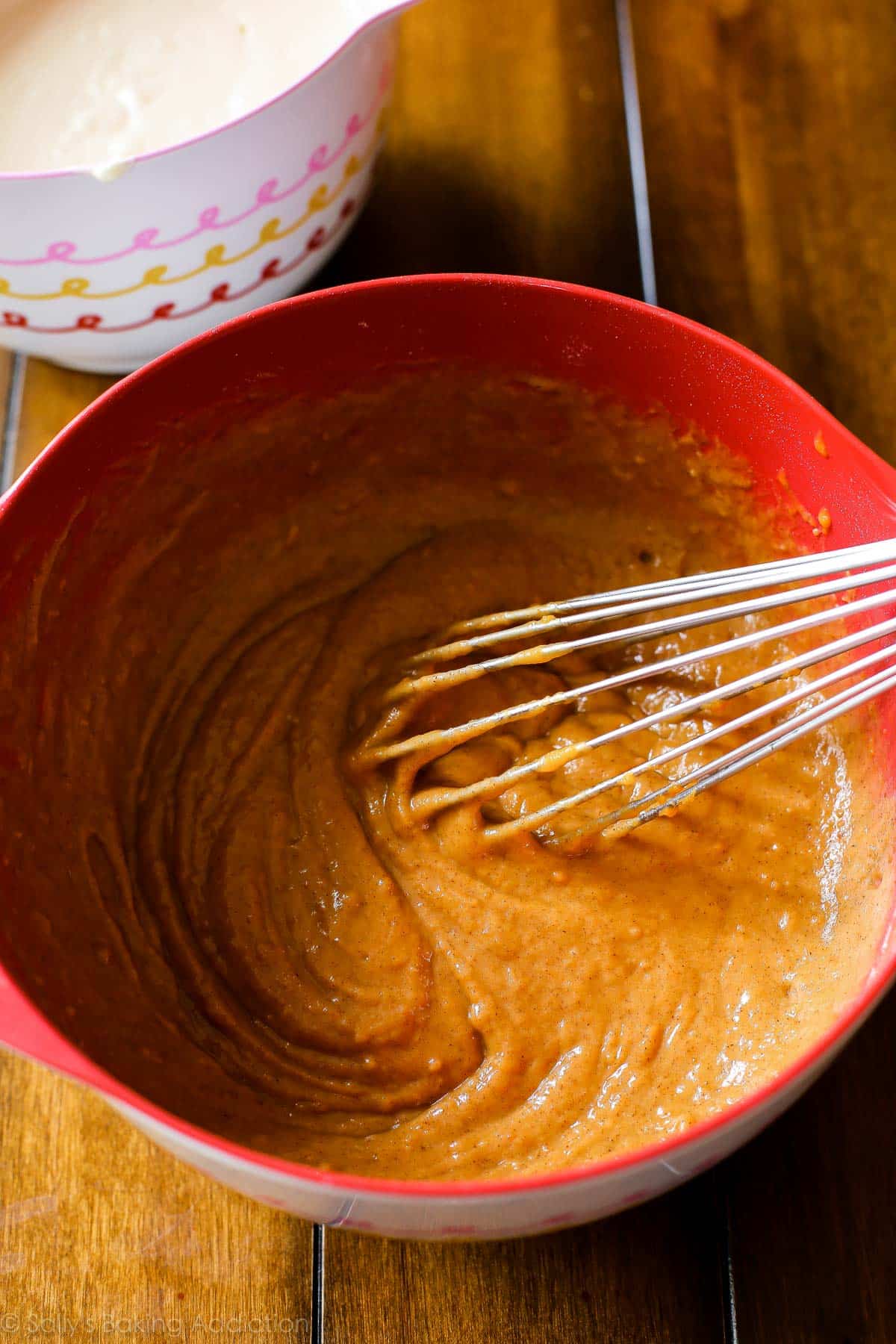 pumpkin cake batter in a mixing bowl