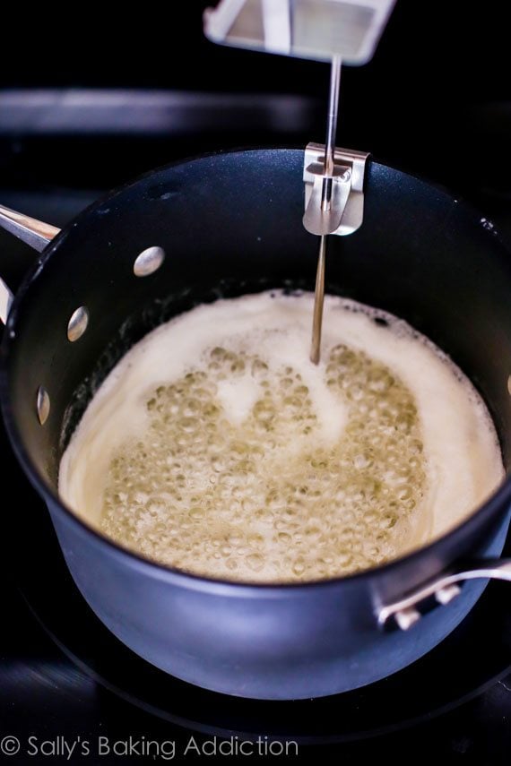 toffee mixture bubbling in a saucepan on the stove