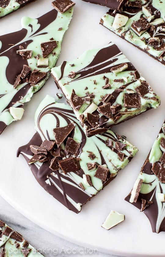 pieces of mint chocolate swirled bark on a white serving tray