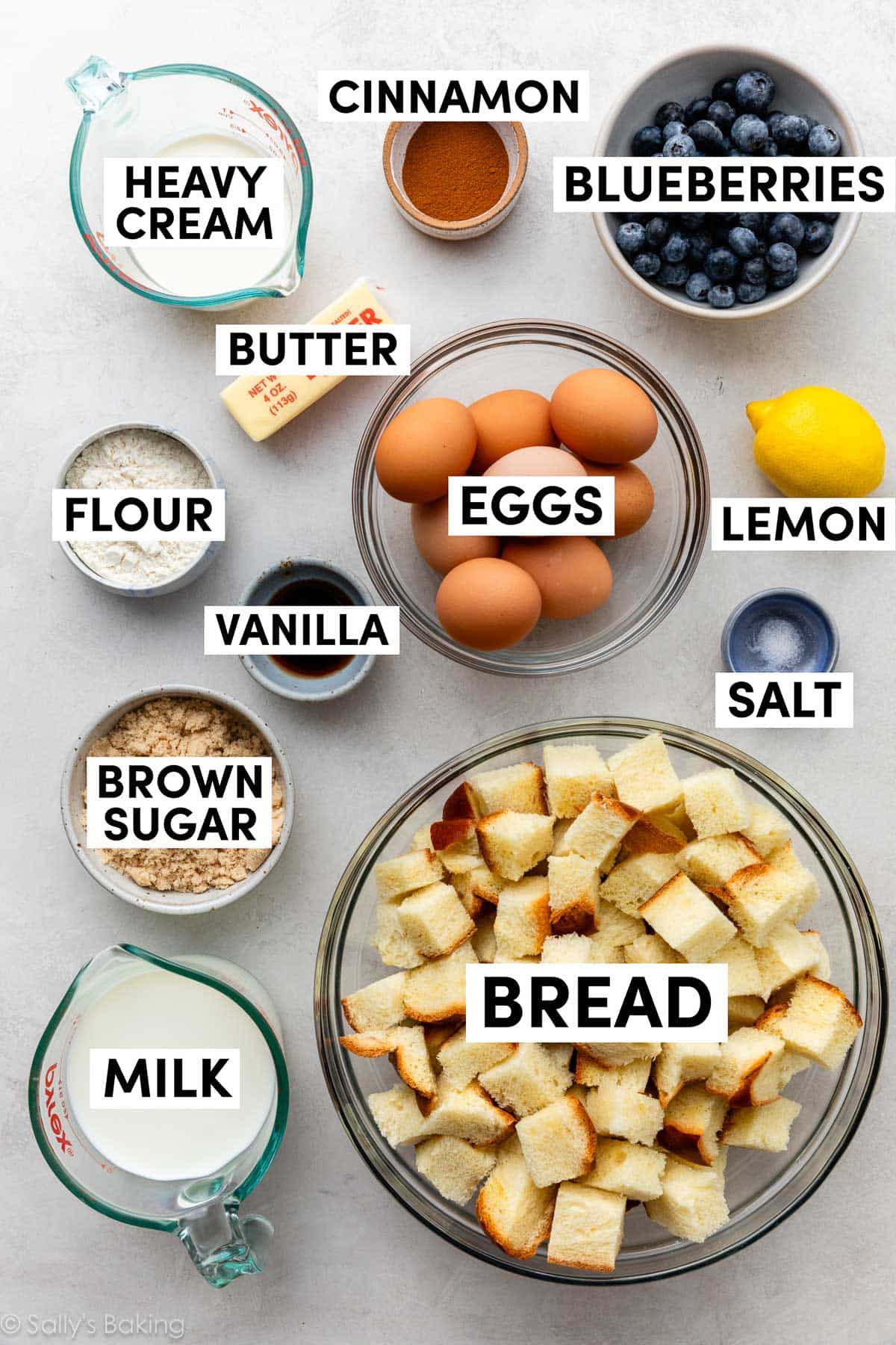 ingredients in bowls including eggs, lemon, salt, brown sugar, milk, and cream.