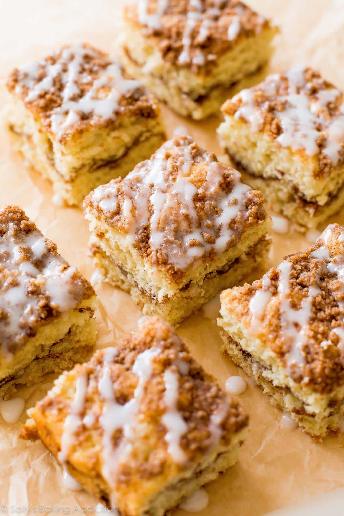 slices of sour cream crumb cake with vanilla glaze