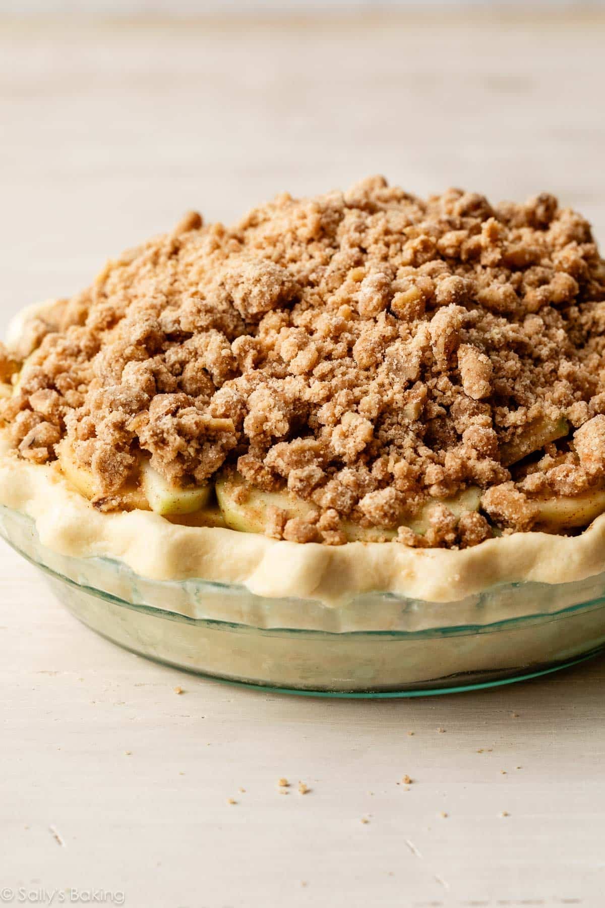 apple pie with crumble topping before baking.
