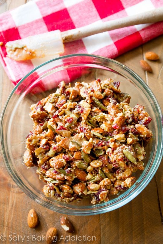 ingredients for pumpkin seed cranberry snack bars in a glass bowl
