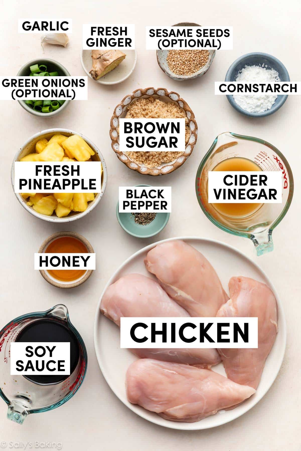 ingredients in bowls including cider vinegar, honey, soy sauce, brown sugar, cornstarch, fresh ginger, and garlic.