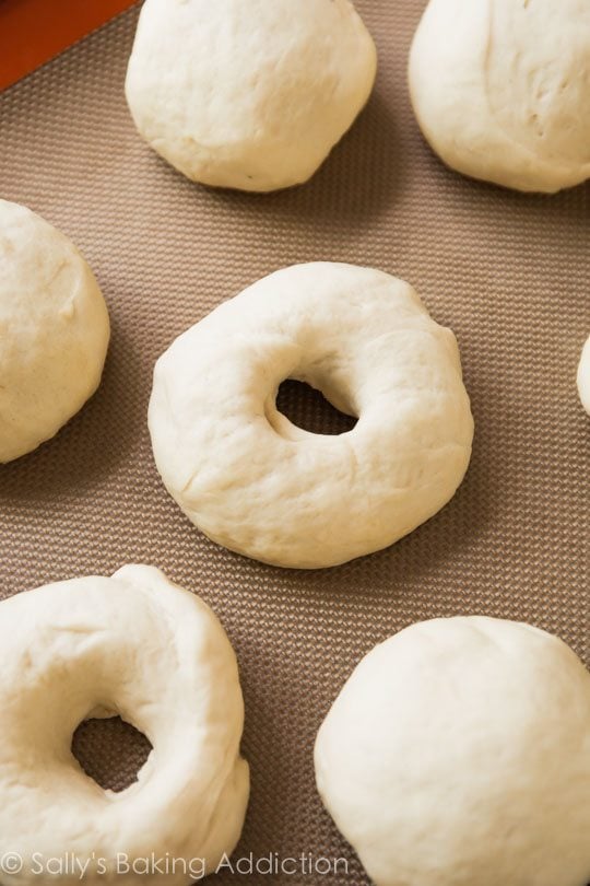 shaped bagels on a silpat baking mat