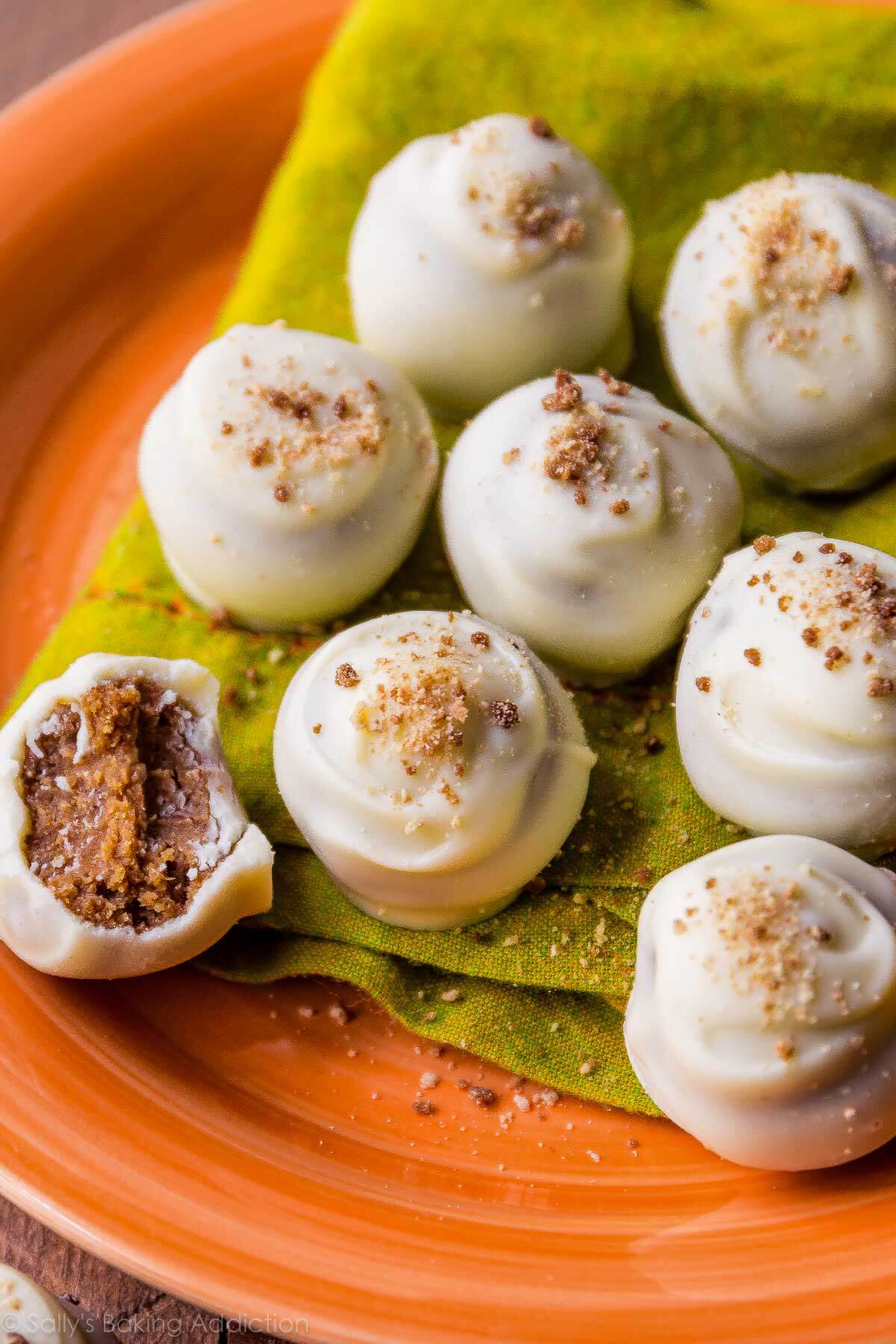 white chocolate pumpkin spice truffles on an orange plate
