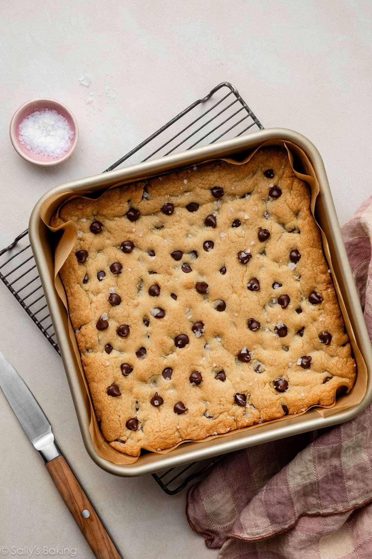 chocolate chip cookie bars in square baking pan.