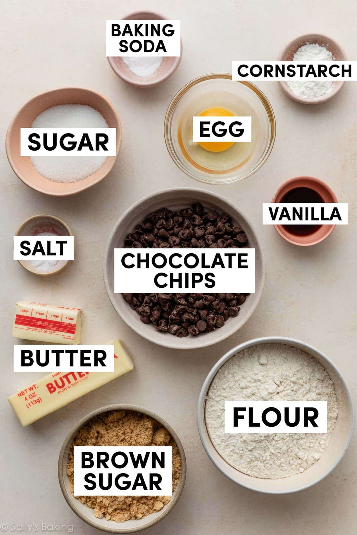 chocolate chips, flour, brown sugar, vanilla, and other ingredients in bowls.