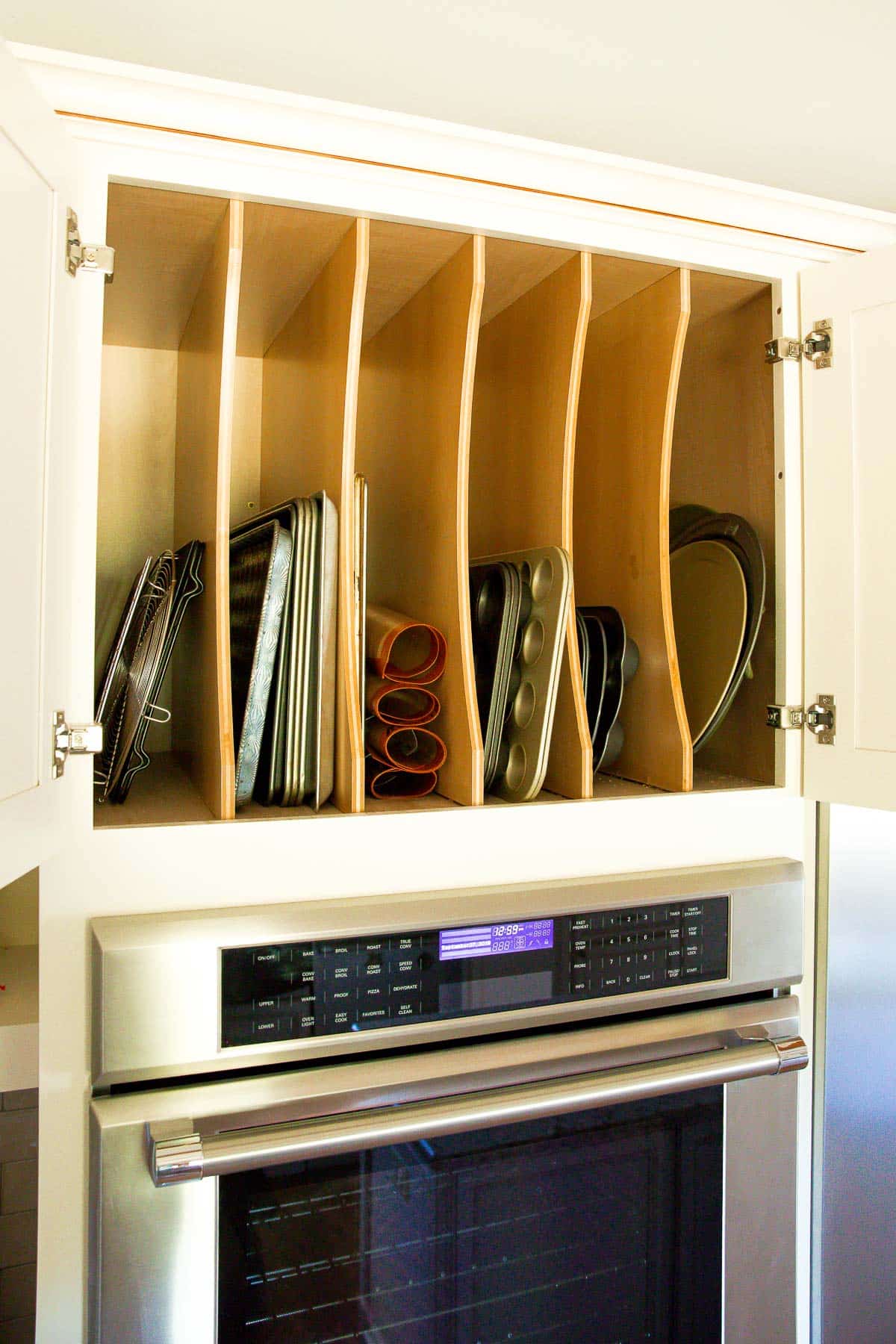 storage for baking pans above oven