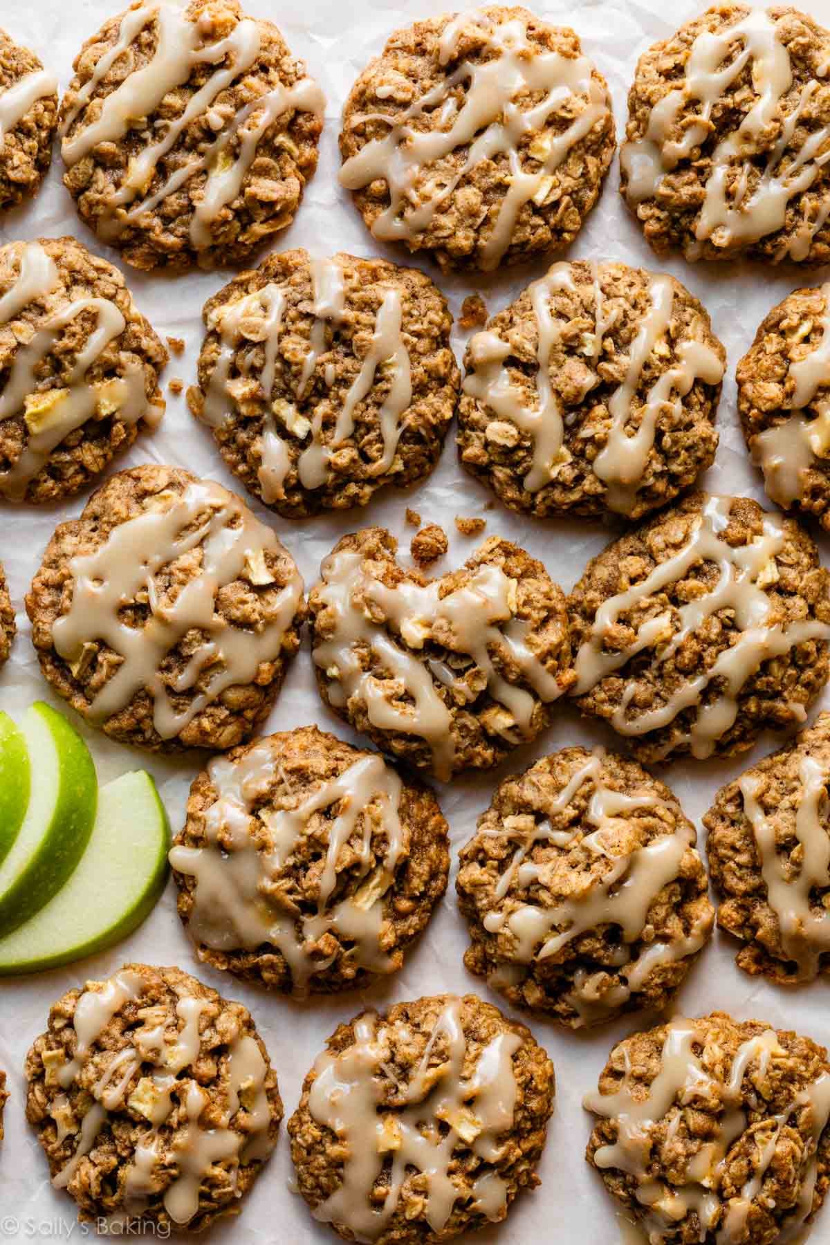 apple cinnamon oatmeal cookies with icing on top.