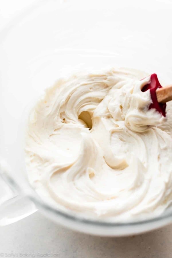 Cream cheese frosting in glass bowl