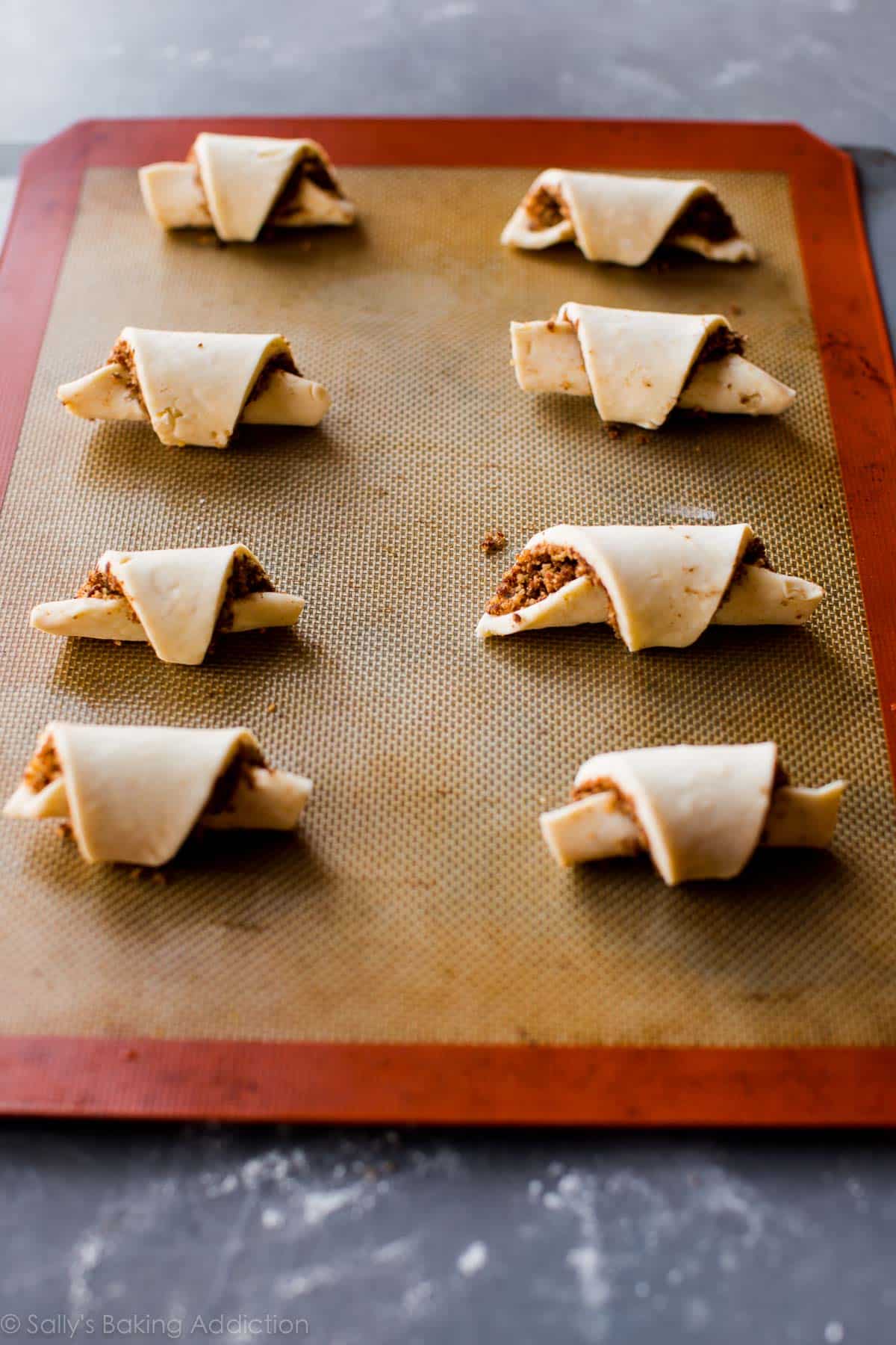 rugelach cookies on a silpat baking mat before baking