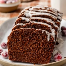 sliced gingerbread loaf with icing on top.