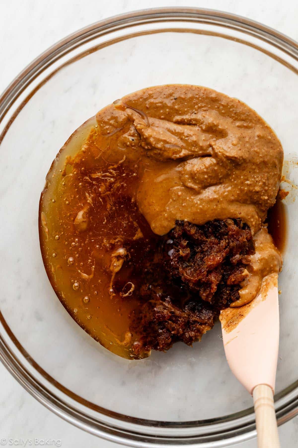 almond butter, date paste, and honey in bowl.