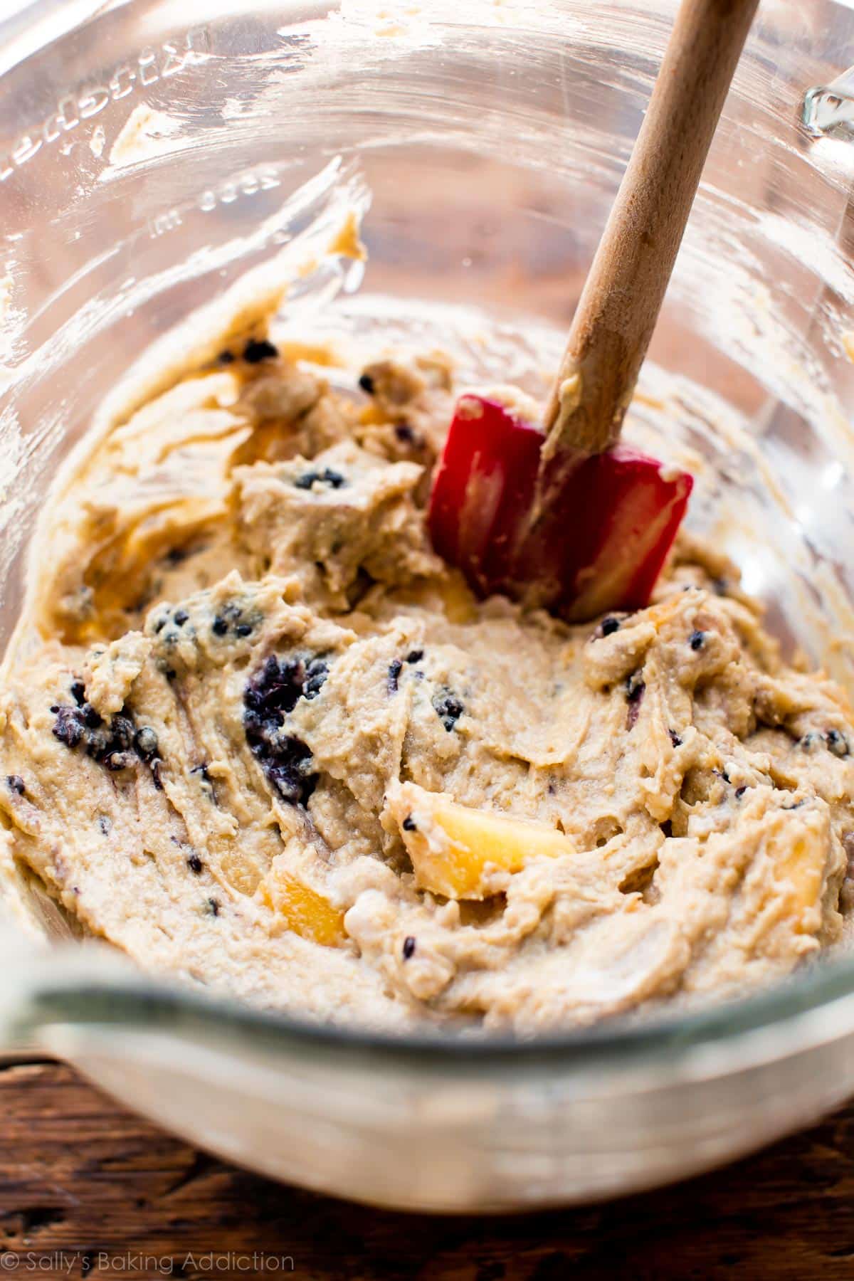 blackberry peach skillet cornmeal cake batter in a glass bowl