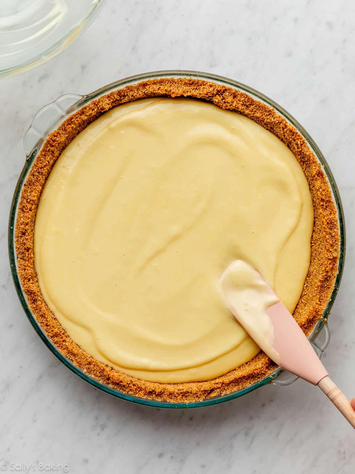filling in graham cracker crust.