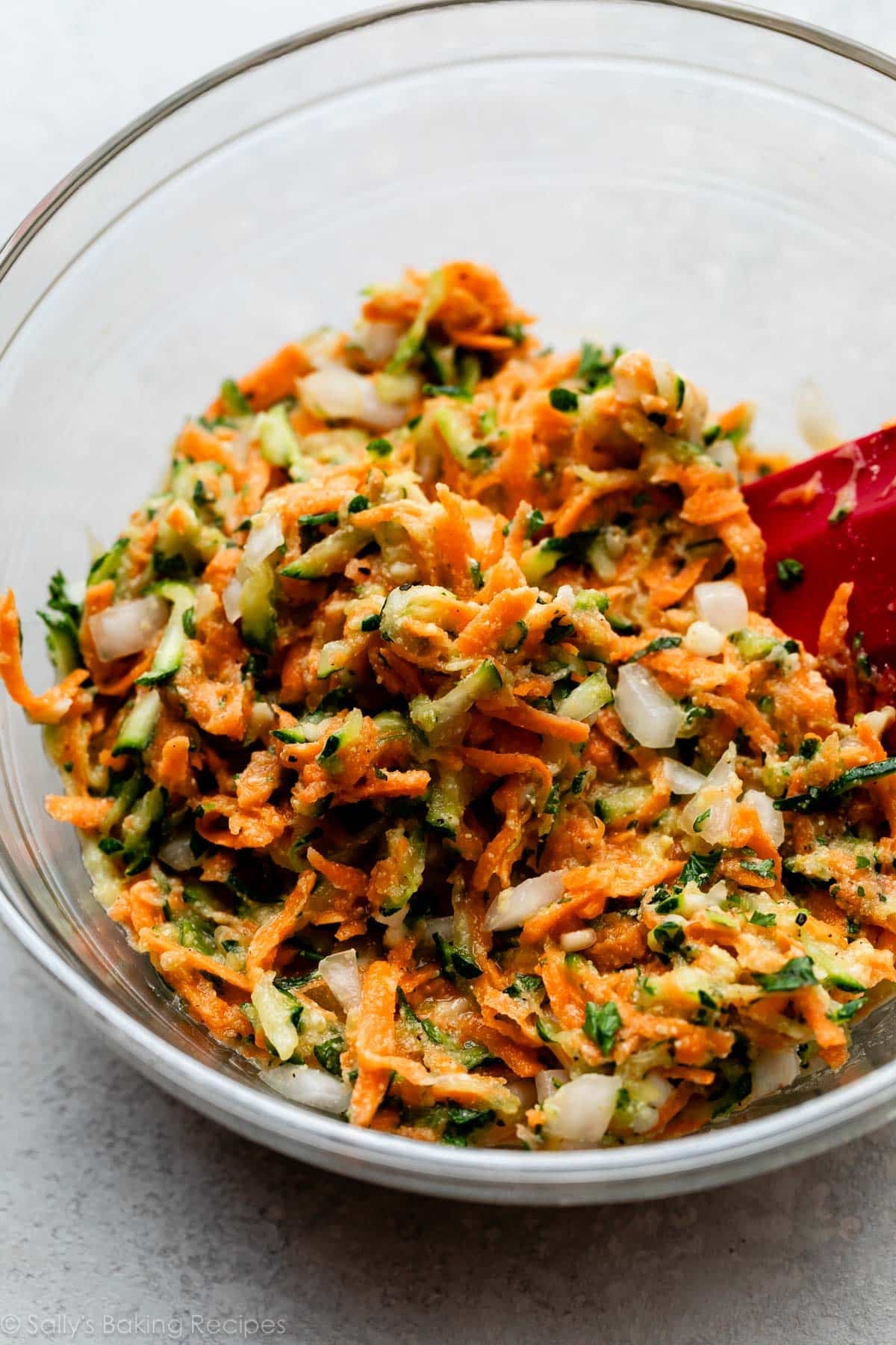 sweet potato and zucchini mixture in glass bowl.
