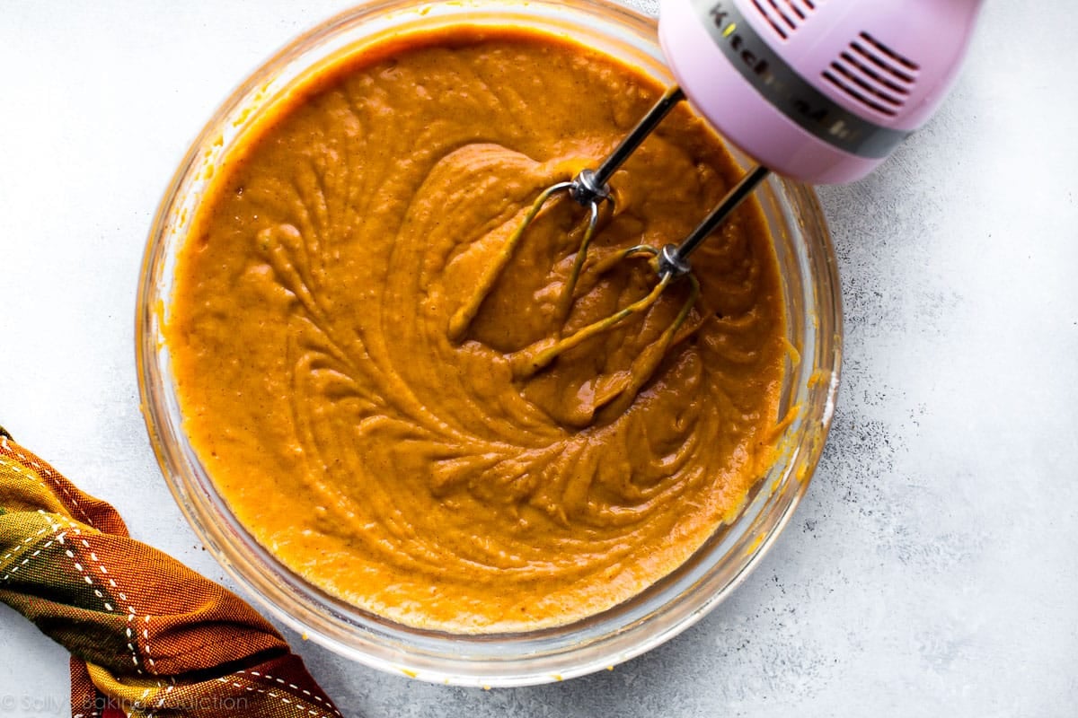pumpkin cake batter in a glass bowl