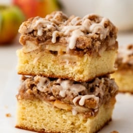 apple crumb cake slice stacked on another slice.