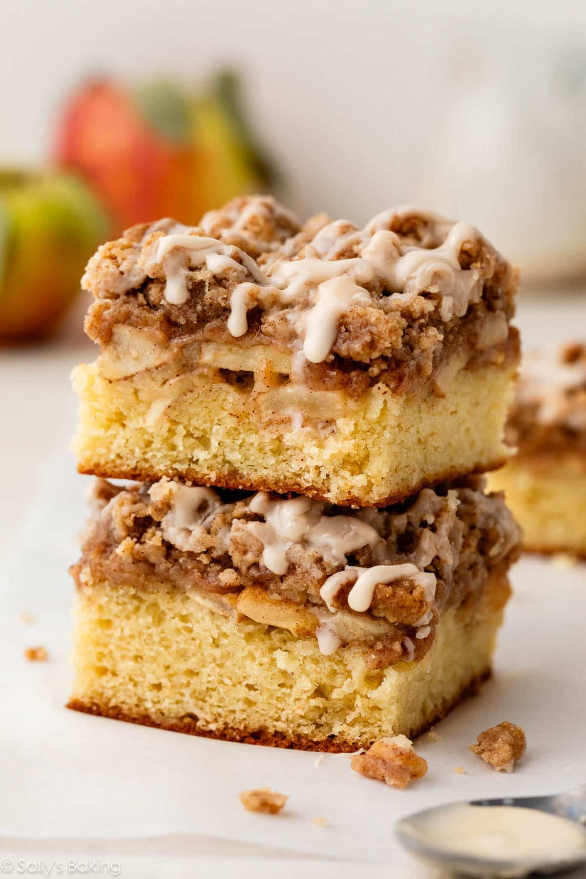 apple crumb cake slice stacked on another slice.
