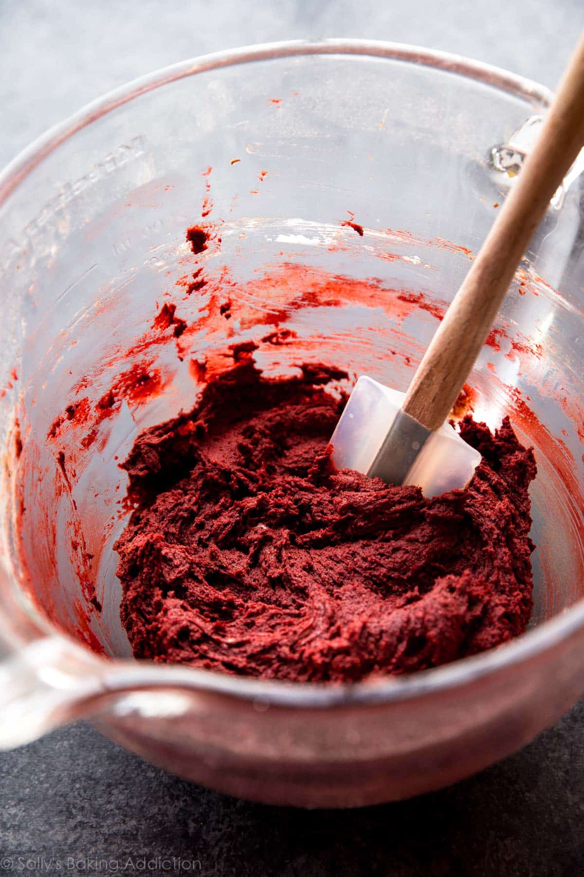 red velvet cookie dough in a glass bowl