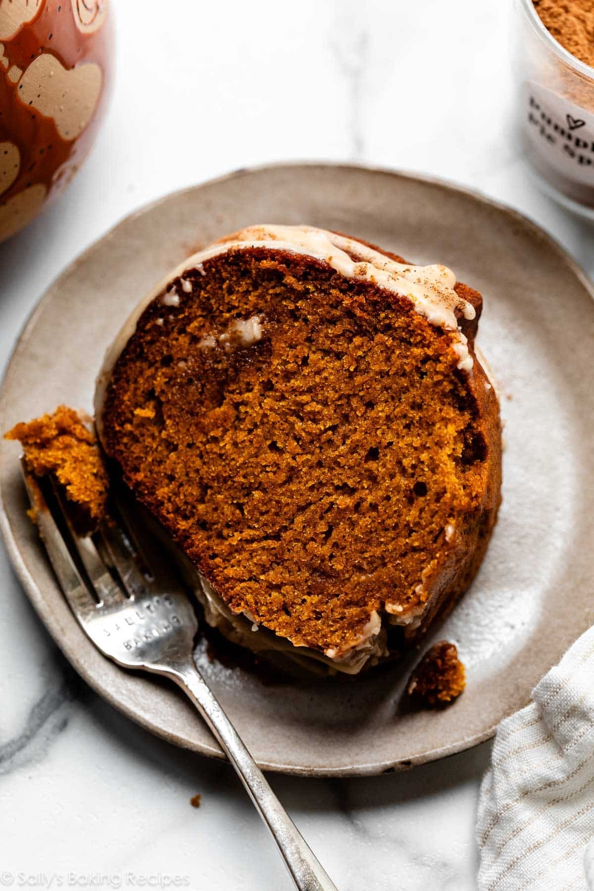 slice of pumpkin Bundt on plate with fork.