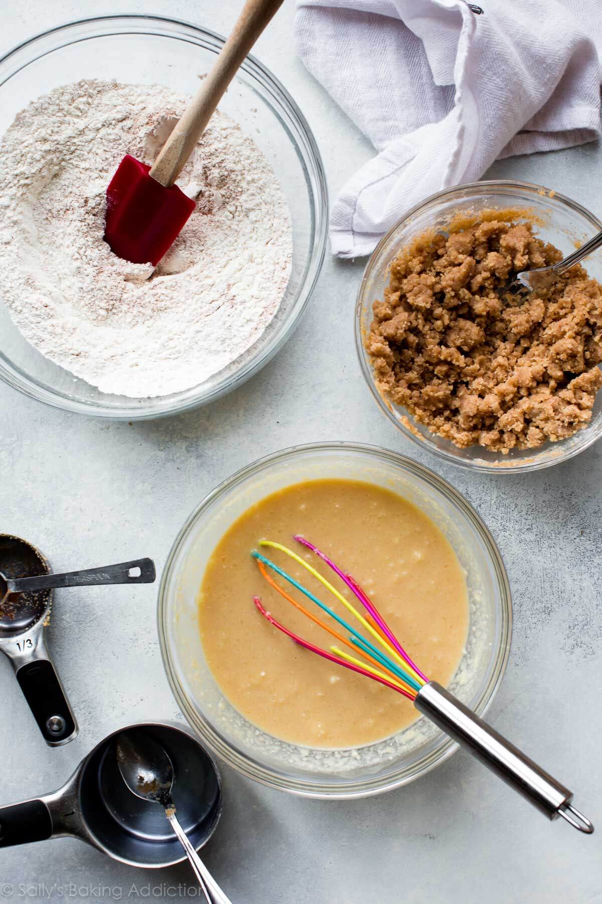 overhead image of ingredients for crumb cake donuts in glass bowls